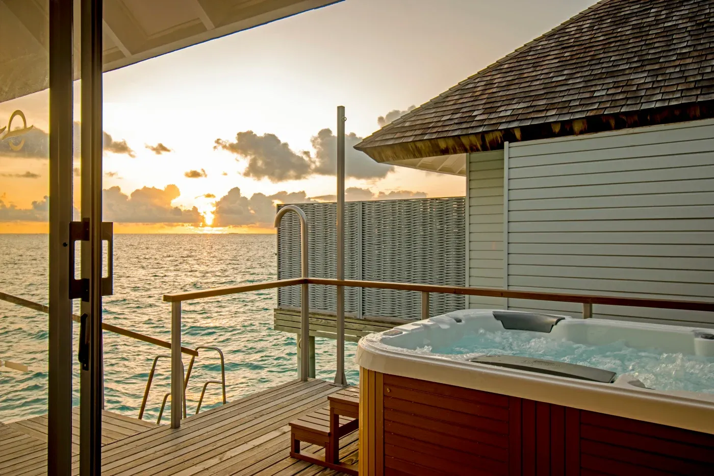 Sunset Over Water Villa with Hot Tub View